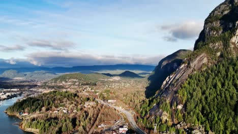 Aerial-View-Of-Sea-to-Sky-Highway-With-Paraglider-Near-Stawamus-Chief-In-Squamish,-British-Columbia,-Canada