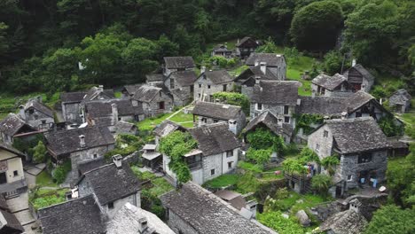Stone-village-of-Foroglio-in-mountains-of-Switzerland,-aerial-drone-view