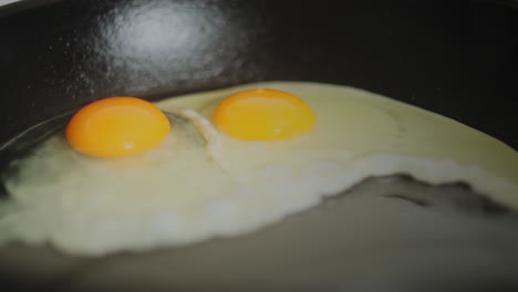 An-Egg-Being-Cracked-into-a-Frying-Pan-with-Oil