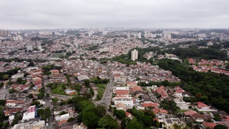 Aerial-view-overlooking-a-suburban-cityscape-of-Sao-Paulo,-cloudy-day-in-Brazil