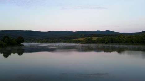Peaceful-lake,-mist-on-surface-near-Varbo,-Hungary