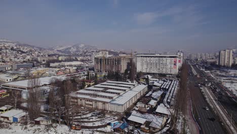 Wide-aerial-view-of-construction-site-of-a-new-residential-building-in-the-cold-winter