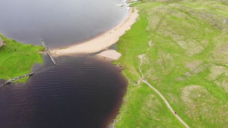 Aerial-downward-shot-flying-over-Ardvreck-Castle-in-Scotland