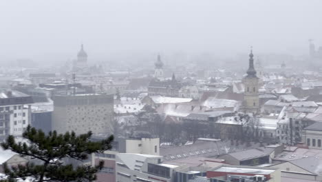 Cluj-Napoca-City-seen-on-a-overcast-and-gloomy-day-at-winter,-surrounded-by-mist