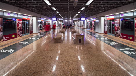People-moving-through-Chinatown-subway-station,-Singapore