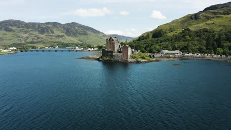 Aerial-view-pulling-away-from-the-historic-Eilean-Donan-Castle-is-Scotland