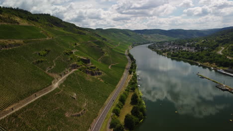 Flight-over-lake-Moselle-next-to-a-vineyard