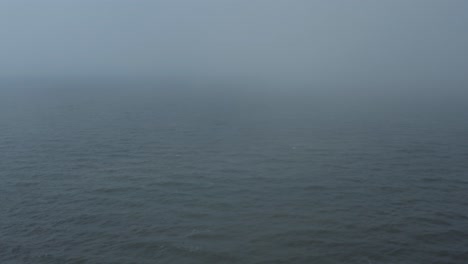 Drone-flying-into-foggy-Ocean
