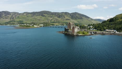 Wide-aerial-view-of-the-Eilean-Donan-Castle-in-Scotland-on-a-warm-summer-day