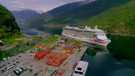 Aerial-view-of-parking-area-with-port-of-Flam-and-docking-Cruise-Ship-with-mountains