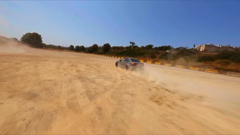 Awesome-FPV-aerial-tracking-a-black-BMW-drifting-in-sand