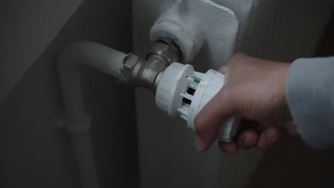 Hand-Turning-On-Thermostatic-Radiator-Valve-Of-Hot-Water-Heating-System