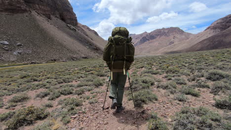 Person-hiking-with-heavy-backpack-on-the-approach-to-basecamp-on-Aconcagua