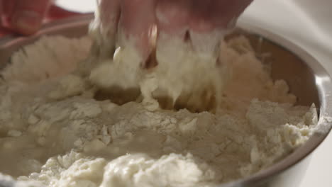 Mixing-Flour-and-Water-By-Hand-To-Make-Dough-For-Bread-or-Pizza-dough-4K-Close-Up