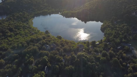 AERIAL---Small-lake-in-the-middle-of-a-forest,-Neuquen,-Patagonia,-Argentina,-forward