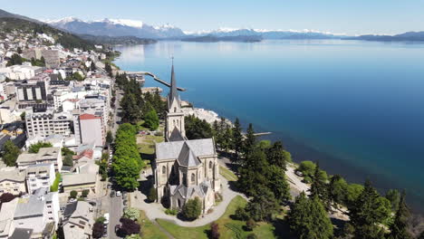 Aerial---Cathedral-Next-To-Nahuel-Huapi-Lake,-Bariloche,-Rio-Negro,-Argentina,-Rising-Reverse