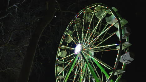 A-low-angle-Wide-shot-of-a-Ferris-wheel-spinning-and-making-a-revolution-in-the-night
