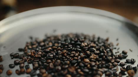 Robusta-coffee-beans-being-roasted-on-metal-plate-in-Uganda