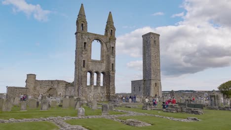 Ancient-St-Rules-Tower,-ruins-of-Saint-Andrews-Cathedral-in-Scotland-with-tourists