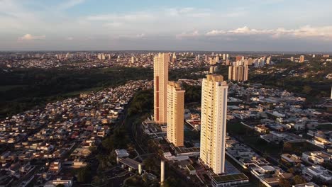 Aerial-circling-residential-buildings-in-Bauru-during-golden-hour,-Brazil