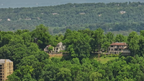 Birmingham-Alabama-Aerial-v32-tracking-shot-along-hillcrest-across-redmont-park-wooded-residential-neighborhood-capturing-various-historic-architectures-and-homes---Shot-with-Mavic-3-Cine---May-2022