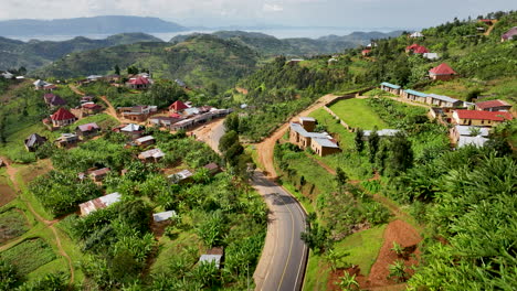 High-drone-shot-of-mountain-side-two-lane-road-in-Rwanda