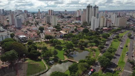 Aerial-flying-over-Vitoria-Regia-Park-towards-center-of-Bauru-city,-Sao-Paulo,-Brazil