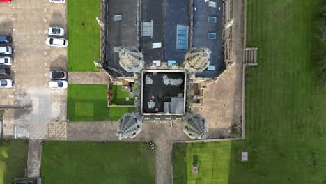 Aerial-drone-flight-over-the-rooftop-of-Saint-George's-Chuch-in-Manchester-City-Centre