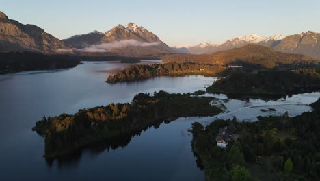 AERIAL---Nahuel-Huapi-lake-in-the-shadows,-Rio-Negro,-Patagonia,-Argentina,-spinning-shot