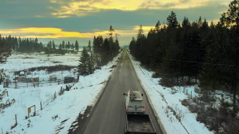 Sunset-Scenic-Drive:-A-Winter-Journey-Through-the-Tree-Lined-Roads-with-a-White-Work-Truck-and-Trailer