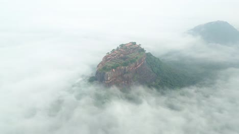 Sigiriya-Lions-Rock-front-in-Sri-Lanka,-village-on-top-of-a-rocky-mountain