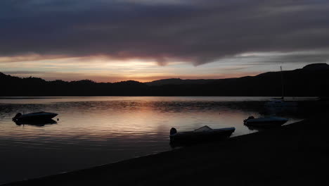 AERIAL---Beautiful-sunset-on-Hermoso-Lake,-Neuquen,-Argentina,-forward