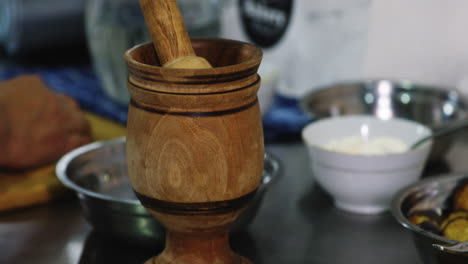 Dinner-ingredients-and-traditional-wooden-kitchen-tool---mortar-and-pestle
