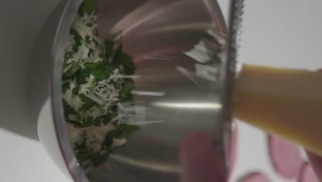 Grating-parmesan-into-a-bowl-with-parsley-and-cream-cheese