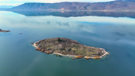 Flying-around-an-island-in-a-calm-lake