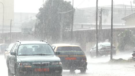 vehicles-commuting-and-traffic-under-heavy-rainfall-during-rainy-season-in-African-city