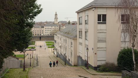 People-Walking-In-The-Montee-Saint-Maurice,-Popular-Staircase-Street-In-Daytime-In-Angers,-France