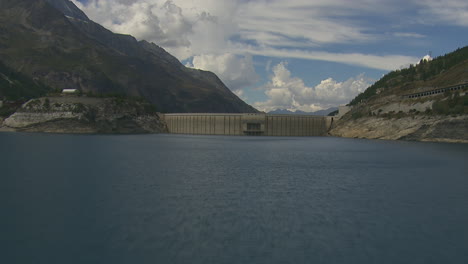 Lake-Reservoir-from-Hydro-Dam-in-Vanoise-National-Park,-France---Aerial-Drone-Flight