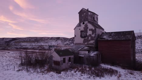 Sharples,-Alberta---February-4,-2023---The-Abandoned-P-H-company-grain-elevator-in-the-ghost-town-of-Sharples-Alberta-at-sunrise