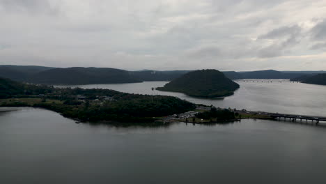 Drone-view-of-the-Hawkesbury-river-bridge-and-boat-ramp-on-a-grey-and-cloudy-day