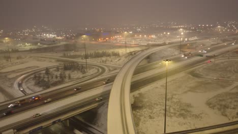 Winter-snow-covered-overpass-Highway-Dynamic-aerial-shot
