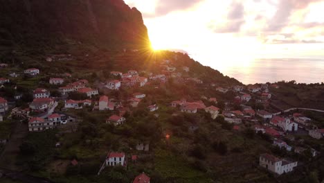 Arco-de-São-Jorge-Village-at-Sunrise,-a-Picturesque-village-on-waterfront-hills,-Madeira-island