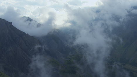Vanoise-National-Park-French-Alp-Mountain-Peaks,-Aerial-Flight-in-Clouds