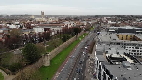 Drone-shot-of-the-City-Walls-and-busy-road-in-Canterbury,-Kent,-UK