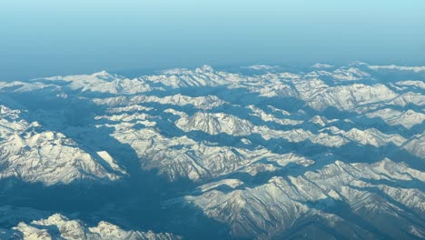 Aerial-view-of-The-Pyrenees-mountains-at-the-golden-minute-after-sunset,-pilot-point-of-view