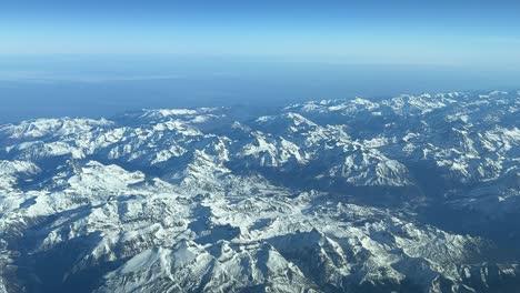 Aerial-view-from-a-jet-cockpit-of-the-Pyrenees-mountains-from-a-jet-cockpit-flying-notrhbound-at-12000m-high