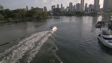 5-February-2023---Aerial-views-over-a-boat-on-Nerang-River-in-Surfers-Paradise,-Gold-Coast,-Queensland,-Australia