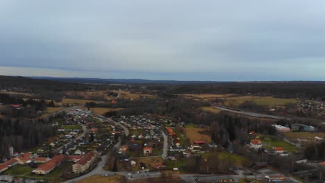Drone-slowly-panning-over-a-remote-village-in-Sweden