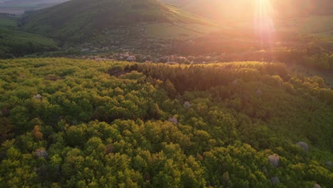 Beautiful-natural-hilly-serene-landscape-at-sunset,-aerial-drone-view,-zajezova,-slovakia,-low-tatras