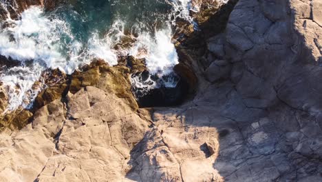 Wonderful-aerial-view-of-Sardinia-natural-pool-and-cliff,-orbit,-dolly-in
